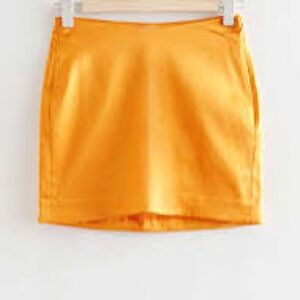 Yellow fitted satin mini skirt